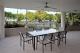 Poolside Penthouse patio by the pool - Vision Apartments Esplanade Cairns